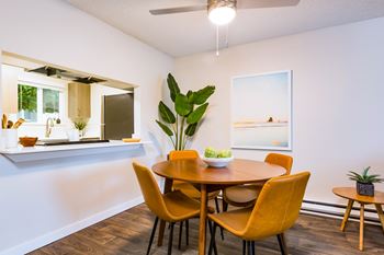 Wide-plank wood flooring throughout living, dining and kitchen areas*